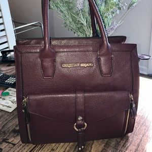 Christian Siriano medium sized burgundy handbag.